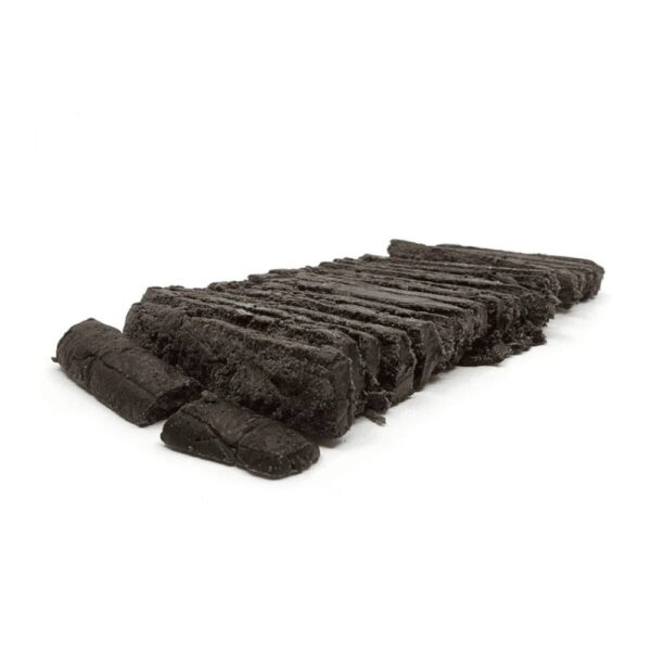 Nepalese Black Hash chopped up on a white background