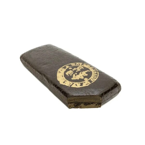 Pakistani Black Hash brick on white background