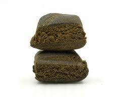 An image of two pieces of moroccan habibi hash stacked on top of eachother.