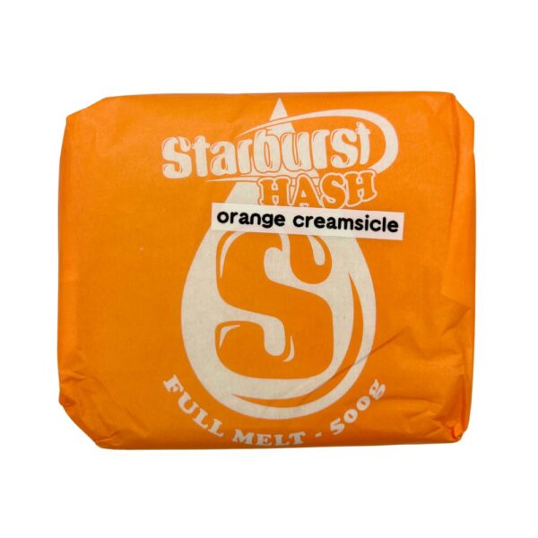 An image of Orange Creamsicle Full Melt Hash with an orange Starburst Wrapper on a white background