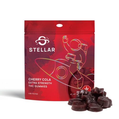 An image of Stellar Cherry Cola Gummies showcasing the gummies next to the red packaging on a white background