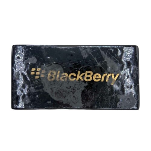 Blackberry Kush Hash brick with a dense, dark brown surface, stamped with a Blackberry phone logo, shown on a clean white background
