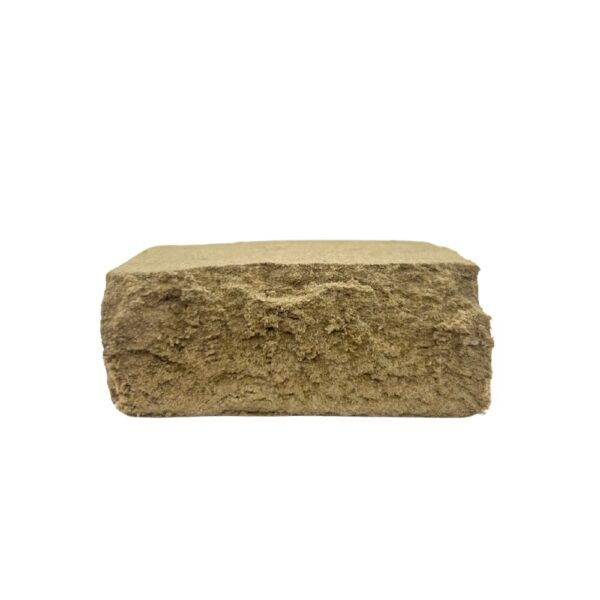 An image of LA Mousse Dry Sift Hash cut in half on a clean, white background